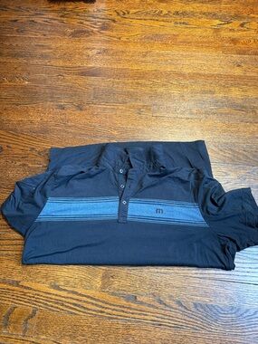 Travis Mathew Polo with Light Blue Chest Stripes and Logo